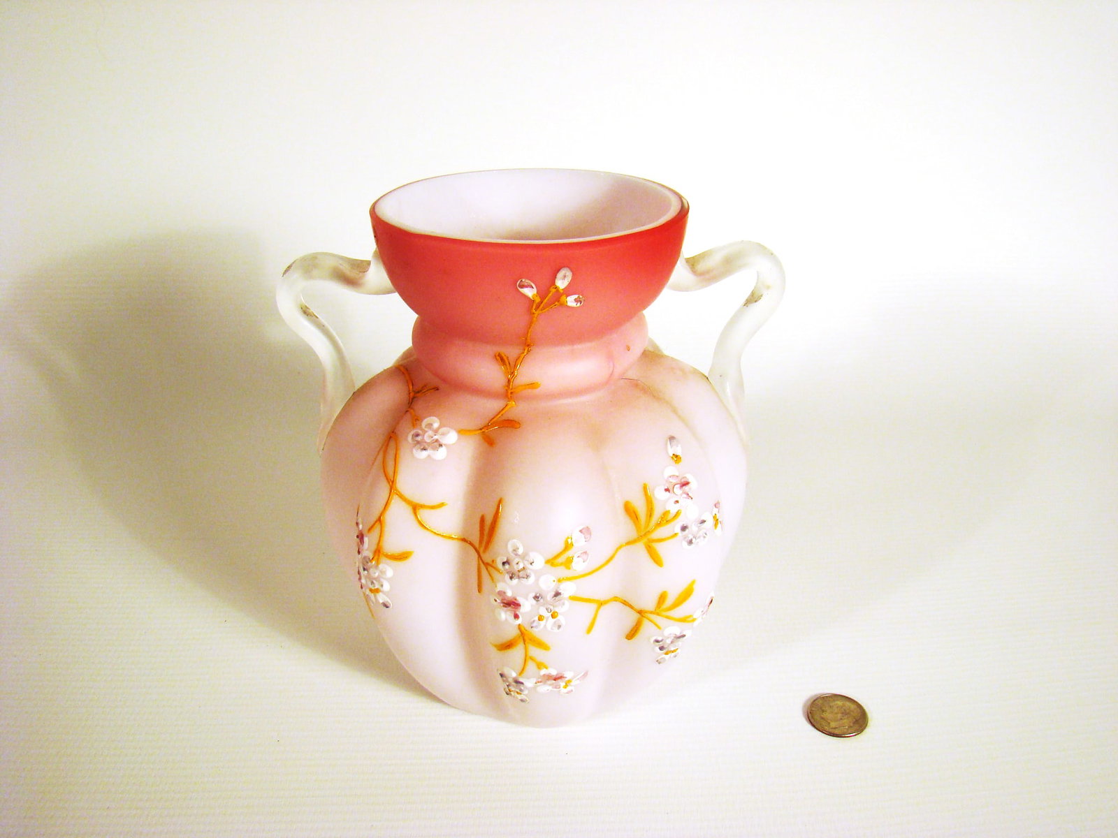 Satin Peachblow Two Handle Vase: Pillow mold design body with clear applied handles over hand-painted foliate pattern.