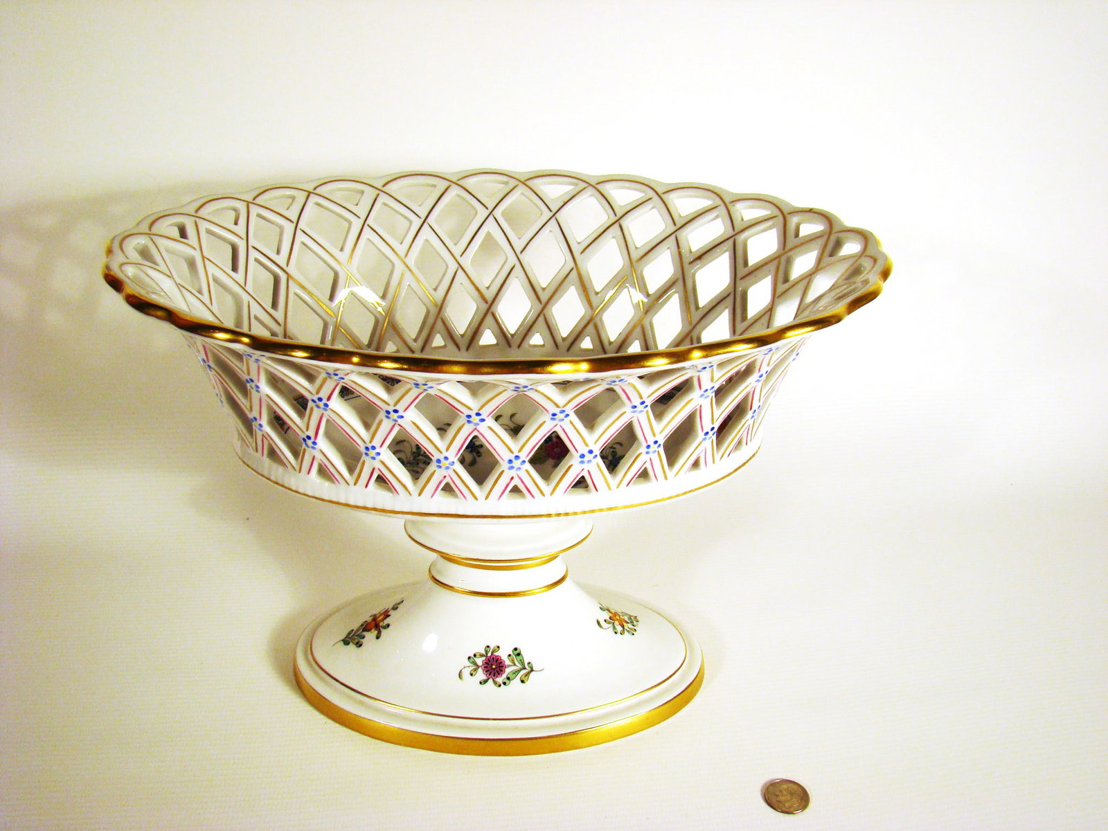 Herend Reticulated Compote: Herend Reticulated Compote with hand painted blooming basket design. Marked.
