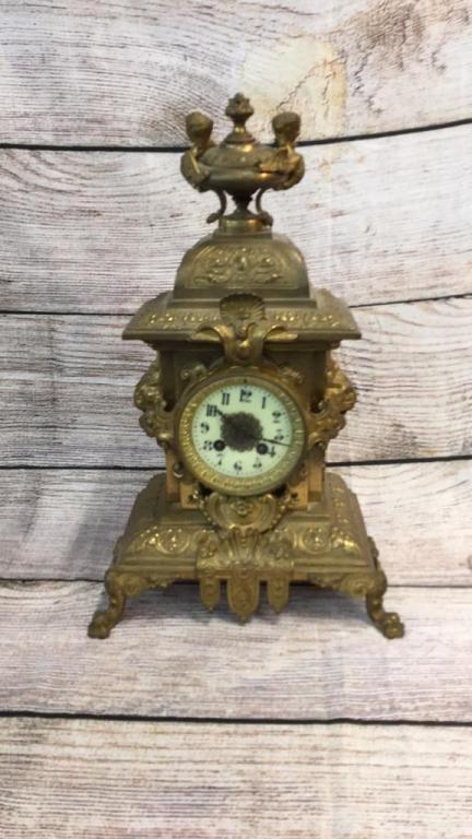 French Gilt Ormolu Mantle Clock: 18" x 11" Lion Head Mounts at Side, flame finial with winged Bust