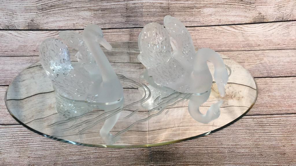 Pair Signed French Lalique Crystal Swans on Mirror: Head up swan 91/2" x12"x7 1/2" and head down swan 7" x 15" x 8 3/4"... Mirror 33" x22" ** small chip to neck of head up swan