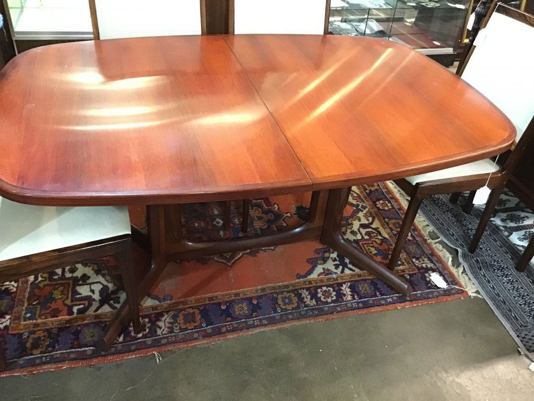 Niels Moller Gudme Mobelfabrik Danish Dining Table: Teak Top w Rosewood legs,Stamped Made in Denmark, Gudme Mobelfabrik 63 long x 41.5 wide x 29 tall. With 1 19 inch leaf is slightly darker than table finish, excellent condition