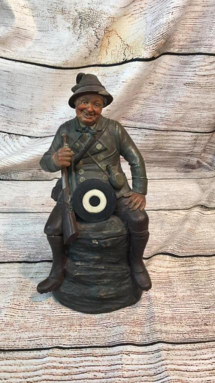 Bernard Bloch Figural Tobacco Jar: Gentlemen with gun and pipe, target at center, 12 inches, stamped on base BB ...chip to hat brim and base