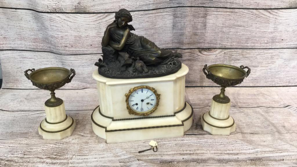 Bronze and Marble Garniture Set: 13 inch Clock with bronze of reclining woman with dove, matching 8 1/2 inch urns with key