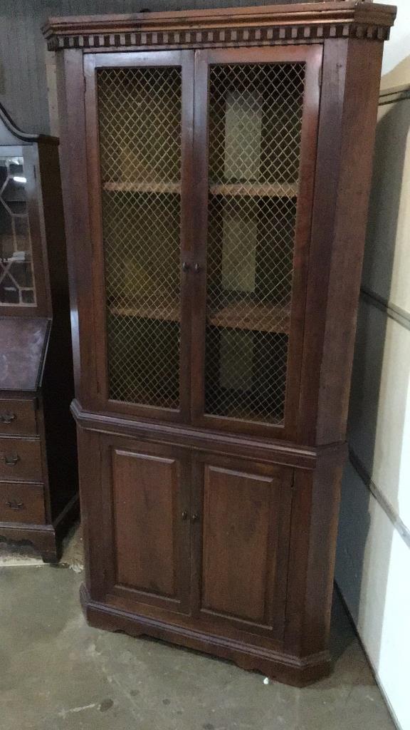 Bench Made Walnut Corner Cabinet: Brass mesh panels, paneled lower doors 80 tall x 38 wide x 18 deep