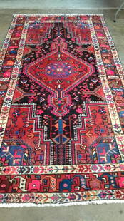 Oriental Carpet: 10 x 5.5 Central Medallion, floral borders, bright colors ..red and black with pink and blue