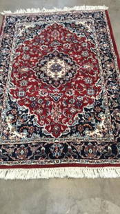 2 Oriental Carpets: 4.5 x 6 feet, Burgandy ground with central Medallion...banded borders of navy and cream, deep fringes....4.3 x 5.5. Rose ground with 8 central panels, floral banded border