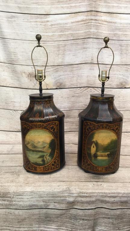 Pair Antique Tole Painted Canister Lamps: 30 inches tall to finial.....oval pictorial scenes at front...mill stream and waterfall...mountain road with lake..black ground with gold ...* some trim loss...