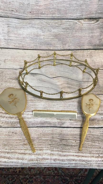 Brass Mirrored Tray, Dresser Set: 16 inch oval mirror tray with cherubic figures holding rope, 3 piece brush, comb, hand mirror set in gold tone
