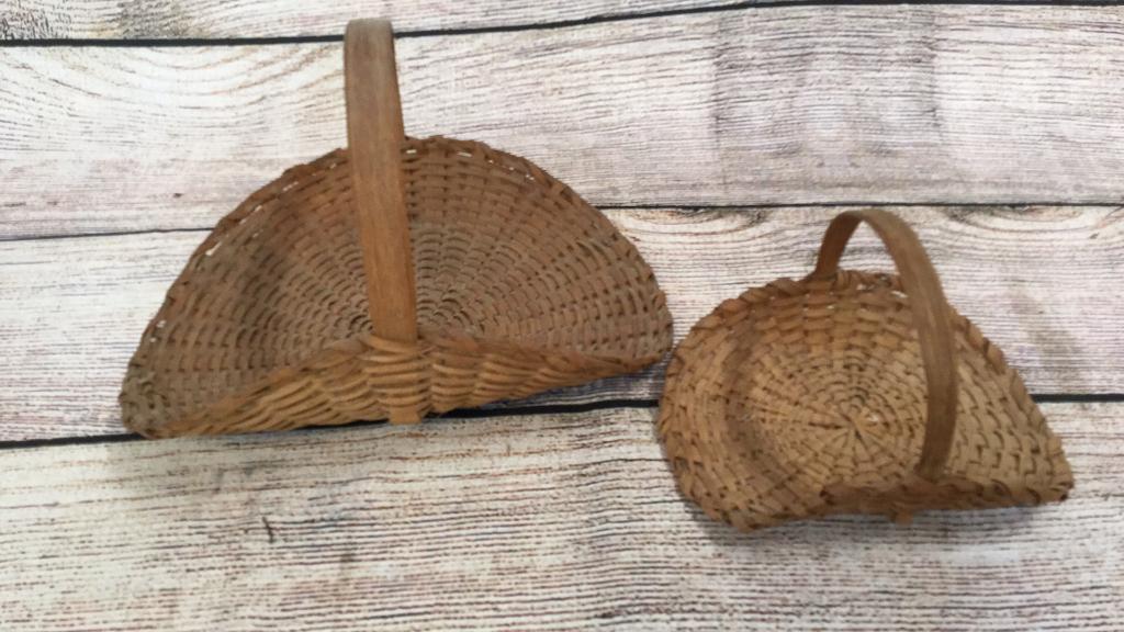 2 Woven Country Flower Baskets: 12 x 7 inches and 8 x 5 both with wood handles, similar patterns possibly same maker on both* need cleaning