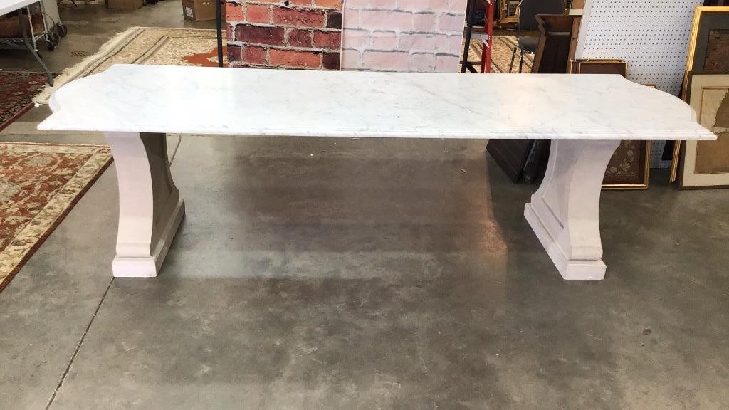 Impressive Marble Table Dining Table: Stone Pilar base, stainless supports under top, comes apart to move. Shipping for this items must be arranged within 1 week of purchase.108 long x 36 wide x 29 tall, no condition issues.