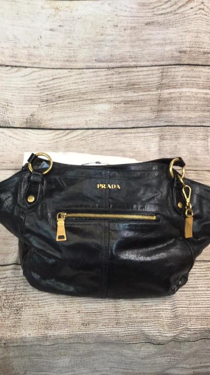 Prada Vintage Black Leather Bag: 11 x 18 inches..double handles...side zipper, brass key fob, interior color is rose with one zip side pocket and one snap side pocket...interior leather Prada Milano Tag...includes cloth dust cover * 