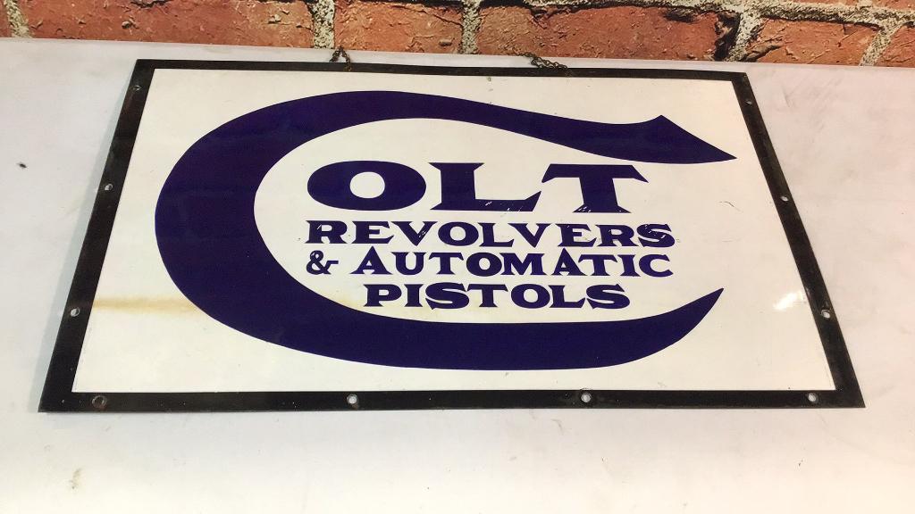 Vintage Enamel Colt Revolvers Sign: 18 x 30, single sided, minor enamel losses around mounting holes