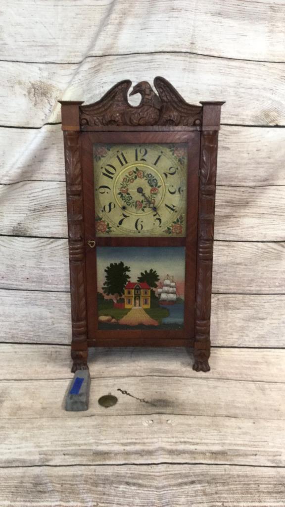 Flyers 8 Day Pillar And Post Clock: Carved supports with Eagle finial....reverse painted lower door, with weight and pendulum...* some repair needs to Case...line158