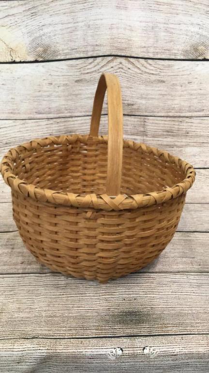 Lucy Cook Half Bushel Basket: Apple basket....bentwood handle.and rim....old attached tag attributes this piece to Colonial Williamsburg basket maker Lucy Cook.....not signed but bears her design to wrapped rim