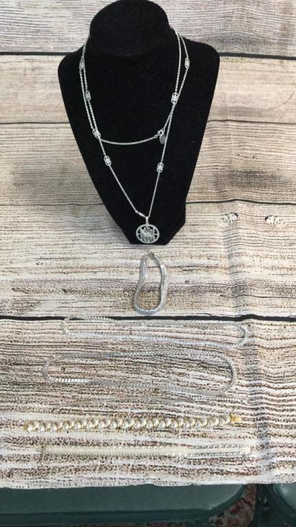 7 Pieces 925 Jewelry: Necklace apron stand is Thailand and stones test as Diamond chips...other pieces marked 925 China or Italy...Stones on lower pieces not tested, bid accordingly