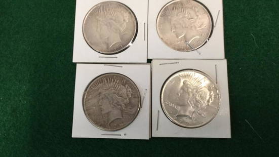 4 Peace Silver Dollars: No mint marks...clear dates ..slight tarnish on 2