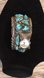 Zuni Wide Cuff Bracelet/ Watch: 2 inch cuff with 13 inset turquoise stones....watch is Timex...no marks inside cuff...* please note stones and metals not tested....line149