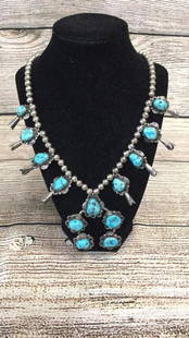 Zuni or Navajo Squash Blossom Necklace: 8 teardrops set in polished silver setting cascade to the Baja set with 5 turquoise stones, Mount is stamped with J...a beautiful design. * stones and metals not tested...line 148