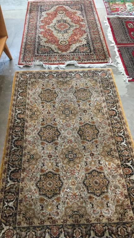2 Oriental Carpets: Approximately 3 x 5 mustard and multi colored...4 center medallions, triple border...3.5 x 5 multi color with center medallion, border fringes