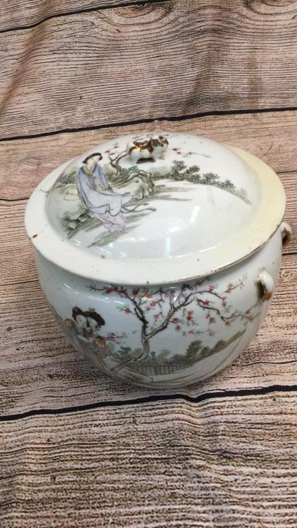Famille Porcelain Lidded Poem Jar: 9 inches tall, front pictorial shows 2 women in garden setting...lid with pictorial and small foo dragon finial....6 character blue mark.....line 71