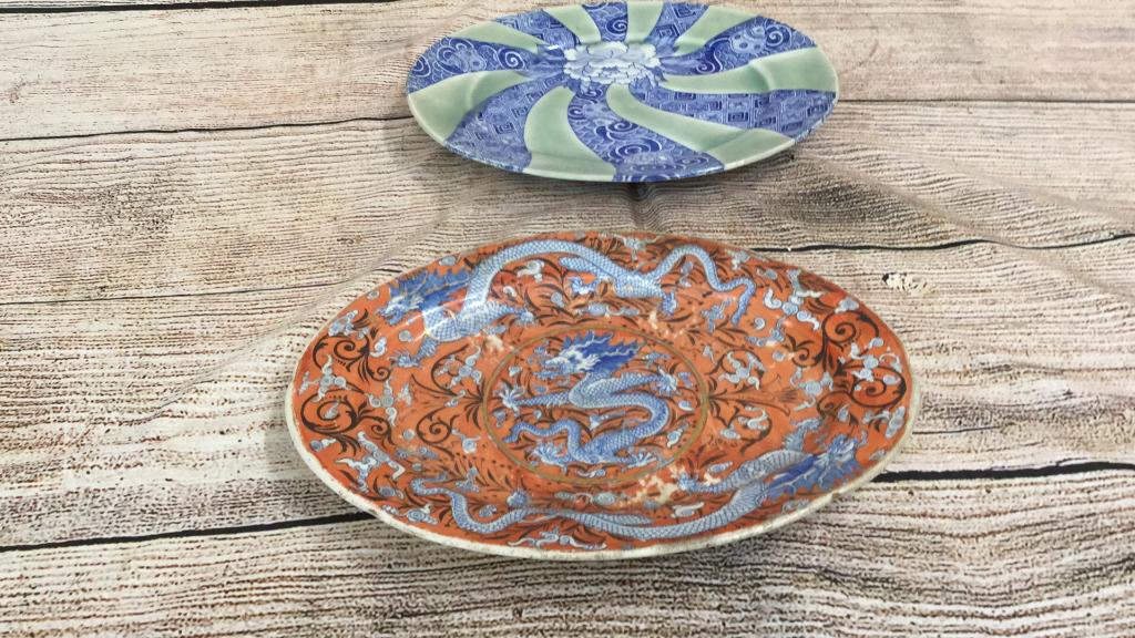 2 Asian Porcelain Platters: 12 oval dragon platter...orange ground with blue dragons.. q12 inch green and blue design with blue florals on reverse...no marks....line 133