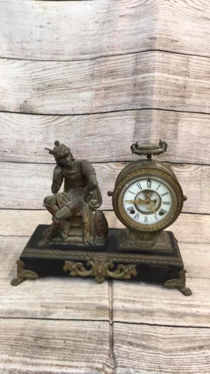 Ansonia Figural Mantle Clock: Empire Ormolu Clock...16 x 14 inches, seated Roman style warrior seated at left...round 7 inch clock with beveled glass front...porcelain dial....clock works are stamped. Ansonia...bronze? * no key, n
