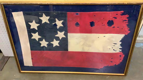 Stars and Bars: Original flag of the Confederacy, used from 1861-1863....7 stars on blue upper left quadrant, 2 red strips with one white center stripe...mounted in display frame* tattered edges, right side,