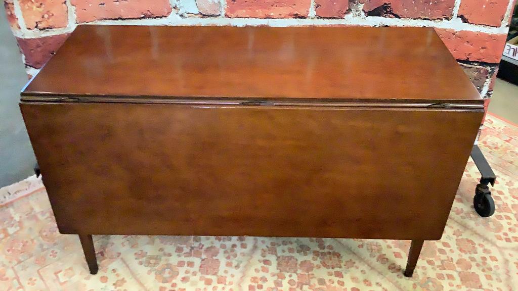 Mahogany Drop Leaf Dining Table: Tapered leg with string inlay, pull outs...47 wide x 29 tall x 55 deep with leaves extended