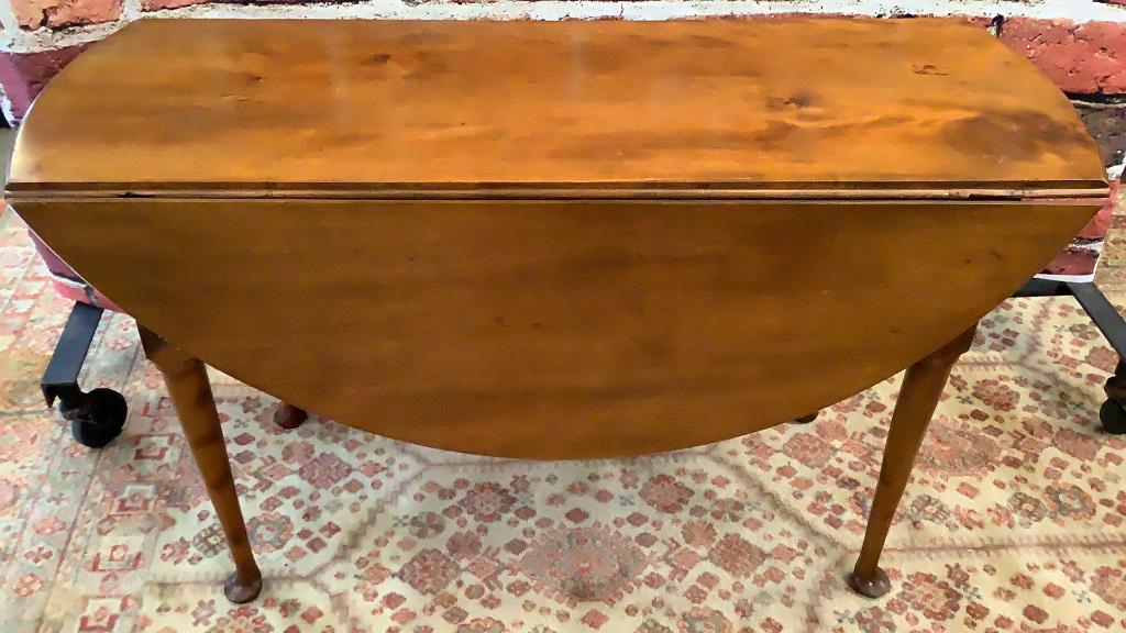Queen Anne Maple Drop Leaf Table: Shaped skirt, cabriole legs ending in pad feet.,.swing leg support, bowed extending leaves..28 tall x 47 inches long, 17 inch deep center ..