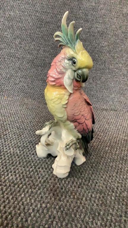 Karl Ens Porcelain Cockatoo: 11 inches tall, pink and yellow colors ..he sits on tree branch...marked at base...good condition