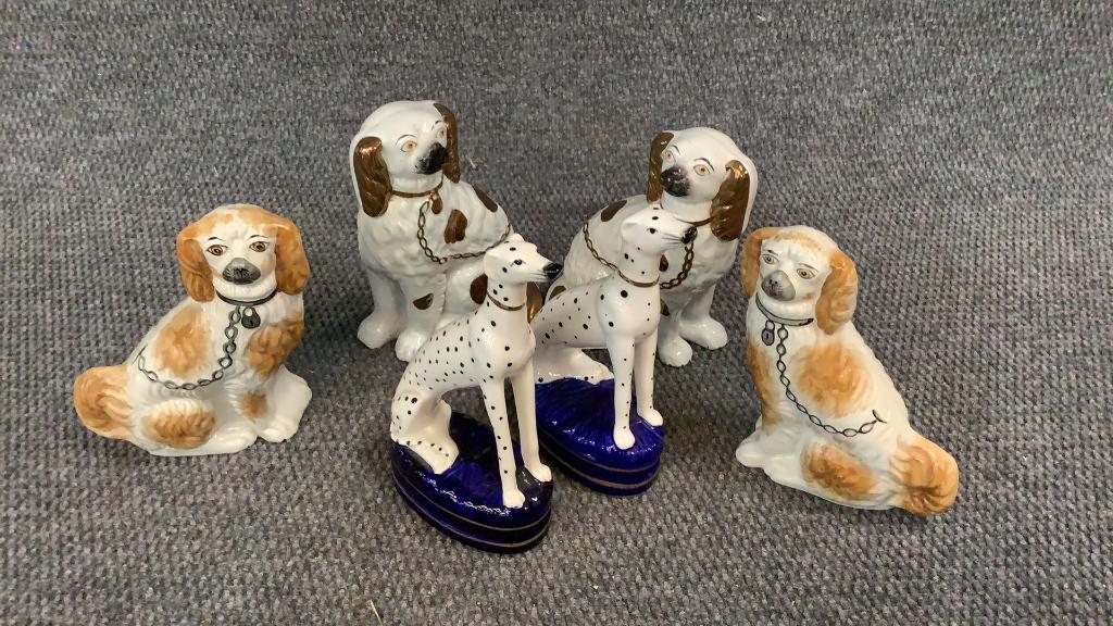 Staffordshire Spaniels, Porcelain Dalmations: 2 pairs each set...8.5 inch pair w/ painted features...gilt paint...8 inch pair with buff color ears and spots, marked Staffordshire...9 inch pair of porcelain Dalmatians seated on cobalt cushions...
