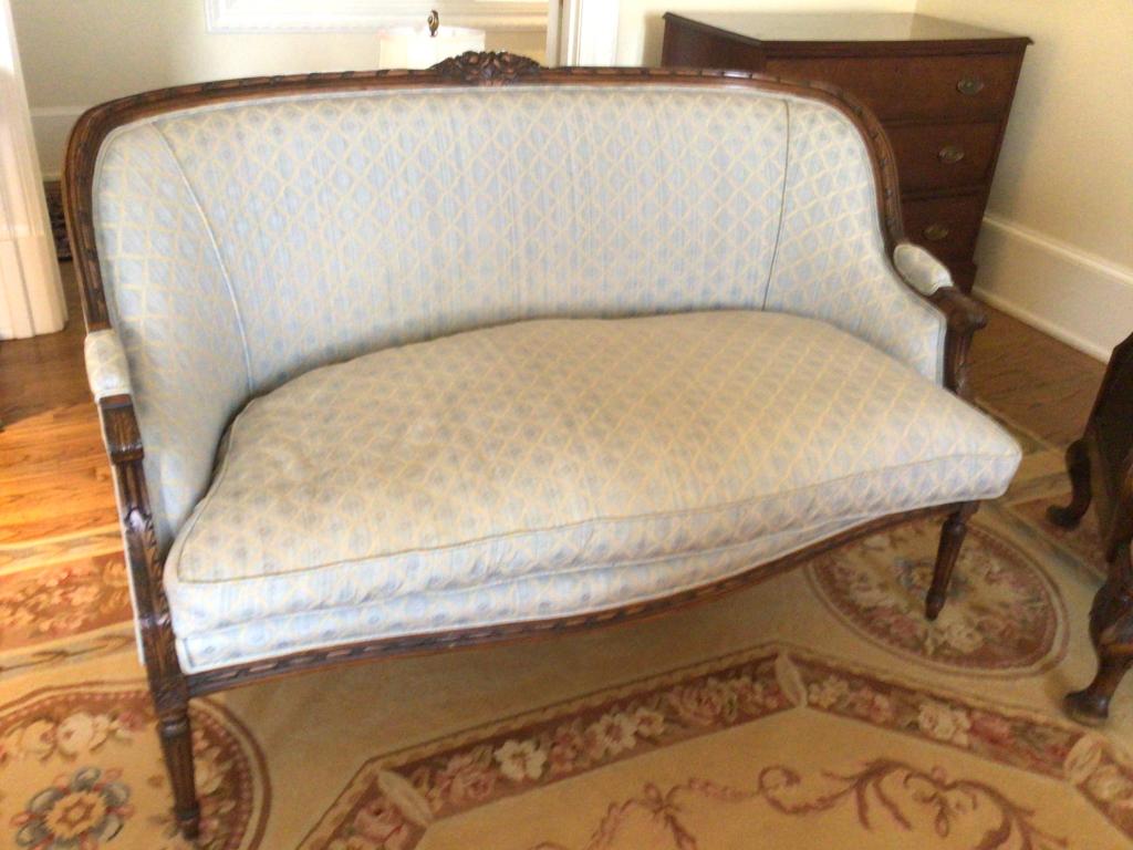 Pair French Provincial Settees: 52 x 37 x 30 deep, custom upholstery in French Blue, carved shoulder rails, with rosettes, carved arm rests, reeded lower legs