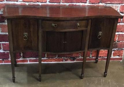 Serpentine Front English Edwardian Sidebaord: Shaped and banded doors and drawer, tambour front doors, spade feet 35 tall x 55 wide x 21.5