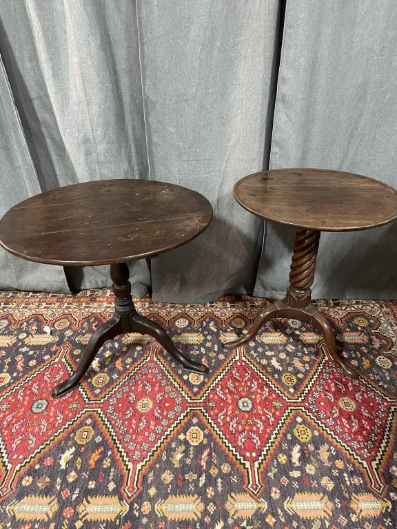 2 Early Oak Tea Tables: 1 oak, pad feet, separation in top 28 diameter x 27 tall 1 Walnut with carved base, dish top, pad feet, 23 diameter x 27 tall Line Item # 18/4