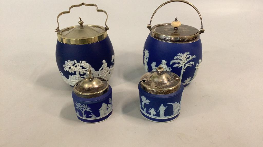 4 Pieces of Jasperware: 6 inch lidded Biscuit Barrel with Hunting Scenes on deep blue body, plated top and handle marked Adams, 6 inch jar with Classical scenes, plated top with bone button, stamped Wedgwood, 2- covered suga