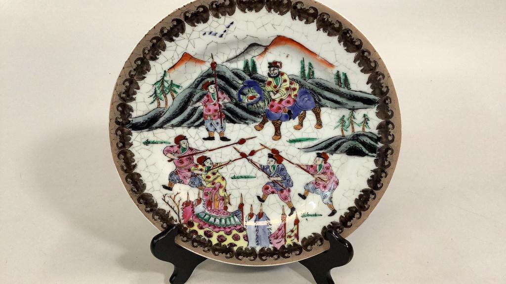 Asian Famille Plate: 10.5 inches, Group of lively warriors with mountain background, bat rims over a crackle glaze ground, 4 character red mark #40