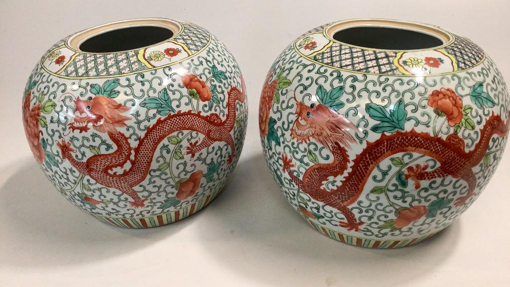 Pair Famille Temple Jars: 9 inches tall, in round form, with undulating red dragon on a white ground…green foliate and peacocks ( no lids)…unglazed foot ring, no marks #55