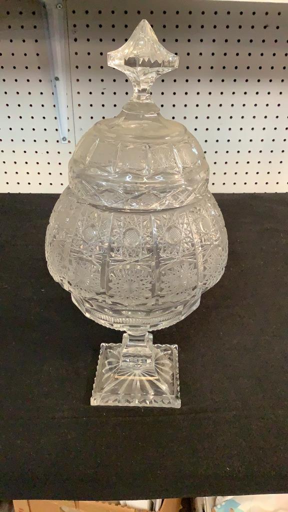 Cut Glass Pedestal Lidded Compote: 15 inches tall, heavy cut crystal dish with hobstar and file …shaped pedestal base…saw tooth base..* tiny rough spot corner of foot..no cracks or hairlines