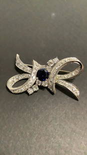 Antique Ladies Bow Design Brooch: Old European Cut Diamonds...center round synthetic blue sapphire, 58 old European cut diamonds 7.2tcw, marked "Irid.Plat" and with maker's mark, 17.0 grams, with old appraisal