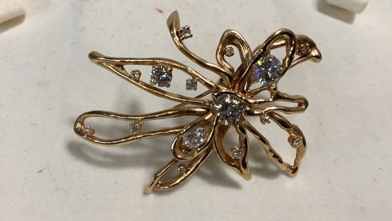 14K Gold, Diamond Brooch: 2.5 Inches, Marked 14 K, Free Form Floral Design, 15 Stones…center diamond .75, round brilliant diamond .65ct, old mine cut .30ct, outer stones estimated 0.30tcw