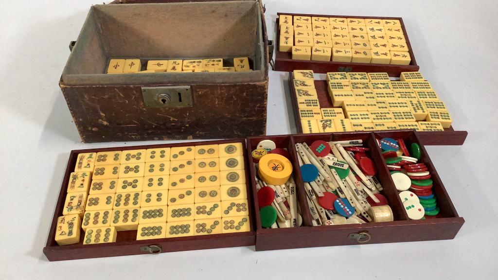 Mahjong Set: Bamboo and Bone, 4 trays are contained in a old case ( originally had a lock) * cannot verify all pieces in set, case has deteriorated 112 tiles total