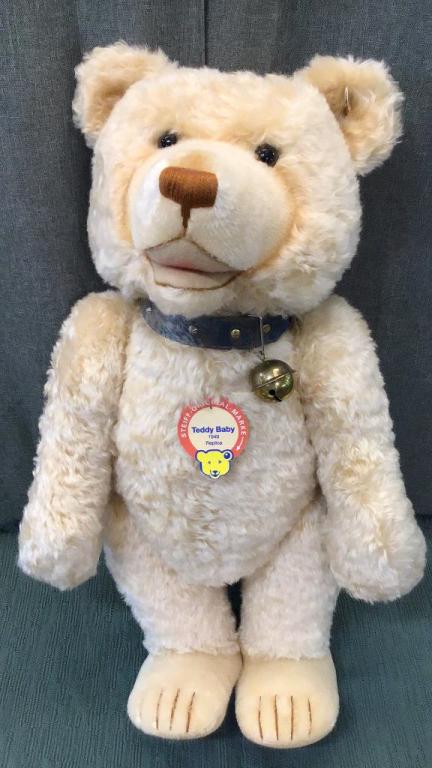 Steiff Teddy Baby 1949 Replica: 30 inch..light blond mohair and matching felt wool pads..golden brown stitching..studded blue leather collar with large bell..fully jointed..collar has discoloration from age..some discoloration to mo