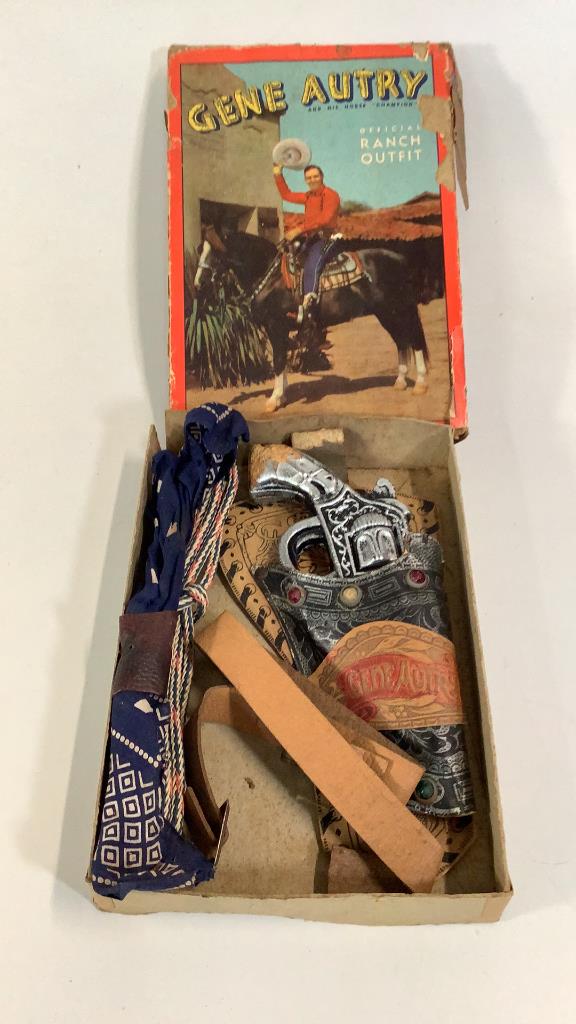 Gene Autry Ranch Outfit: Original boxed set includes belt lasso, bandana, composition gun in holster…* has been stored and there is loss to “gun”, box has damage and fold wear, cover graphics still good