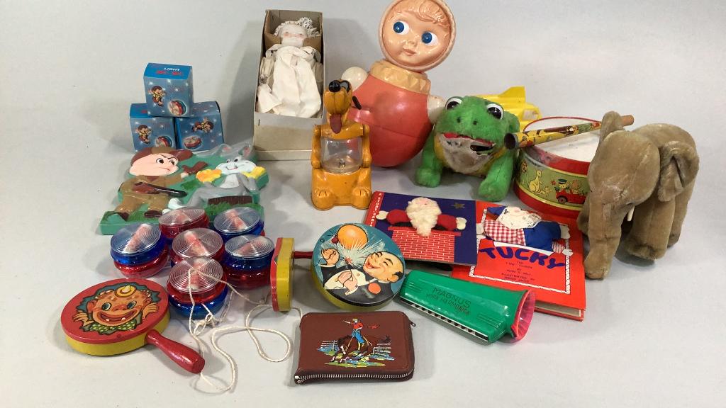 Collection of Assorted Vintage Toys: Noise makers, yo-Yao’s, books, reproduction doll, Roly Polly doll, stuffed elephant, toy drum, Pluto lantern night light, wall plate of bugs bunny,