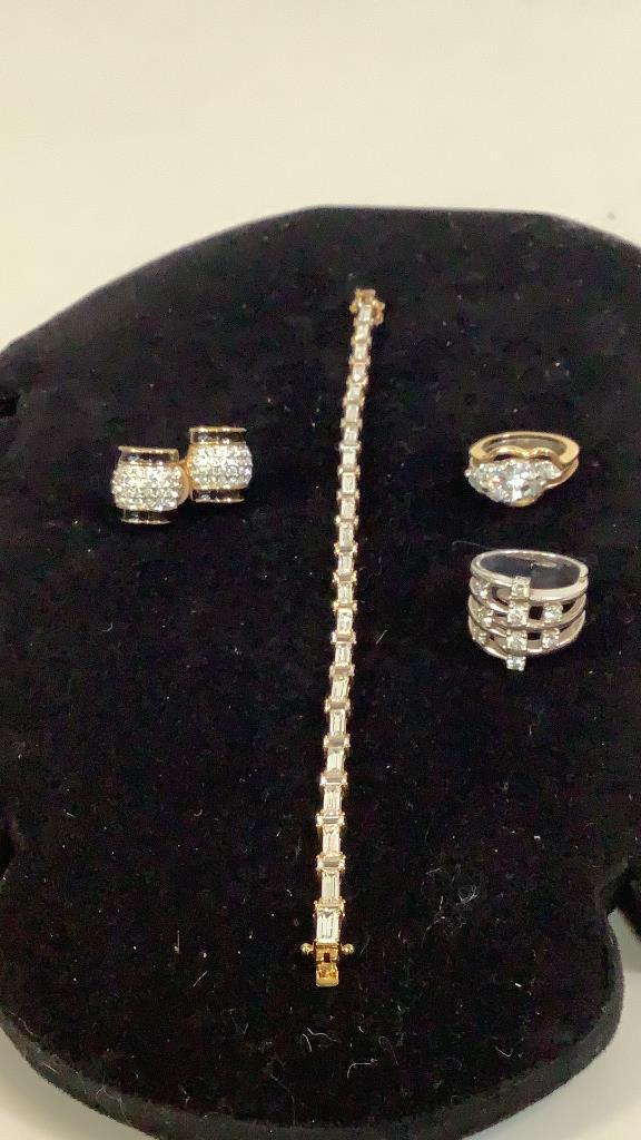 Baguette Bracelet, 2 Rings, Swarovski Earrings: Rings with clear stones, 8 inch tennis style bracelet, pair clip earrings marked Swarovski… #12, #20