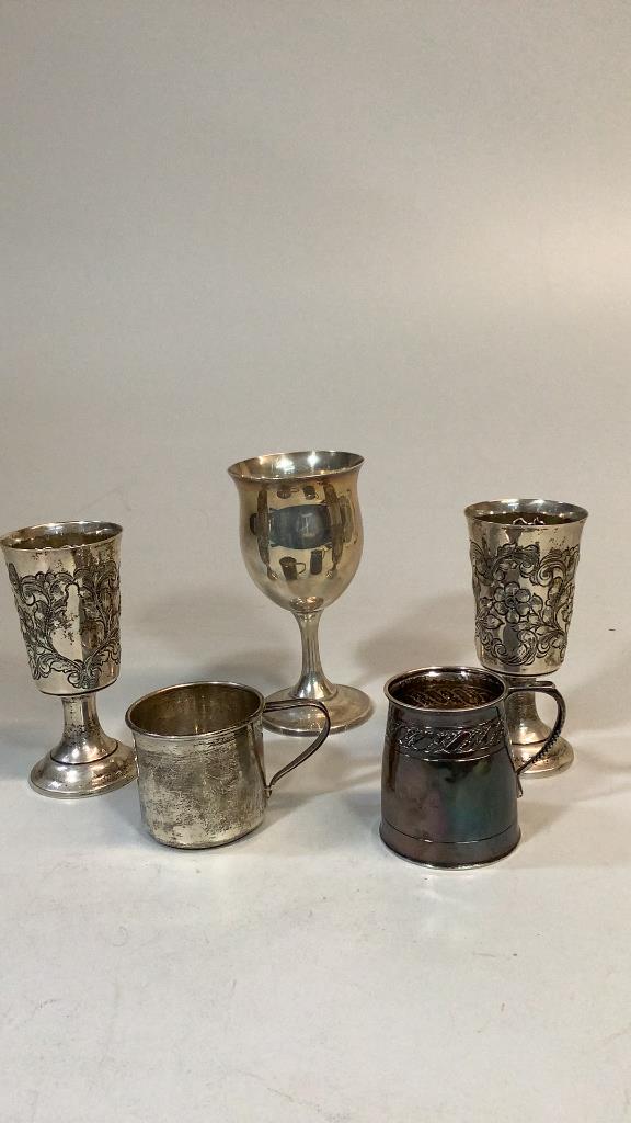 5 Sterling Items: Reed and Barton 6 1/4 inch Goblet, pair of 5.5 inch hand chased Wine cups, Alvinnsterling baby cup, English sterling 3 inch tankard or cup