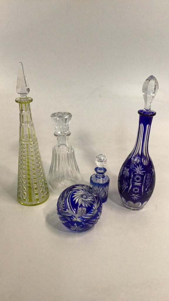 Baccarat Decanter, 4 Pieces Bohemian: 10 inch Baccarat decanter with matched stopper, 15 inch Bohemian cobalt decanter, slant base Bohemian ashtray , 6 inch bottle, 16 inch tapered spire decanter with Hex and hobnail, Citron