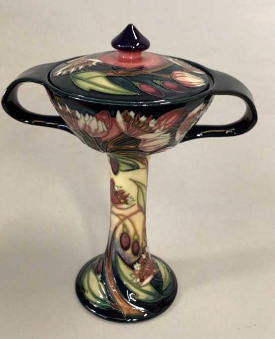 Moorcroft Symphony Bonbonniere: Designed by Emma Bossons, introduced in 2004 to MCC, signed by designer stamped and dated..8 1/4 inches tall…great colors on a dark ground Line Item # 48