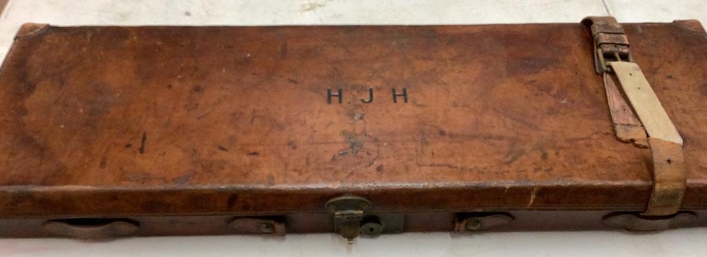 Leather Gun Case: 34 x 11 x 3 inches…Felted sectional interior for a break down Gun……leather straps…branded initials upper HJH..* some damage to strap