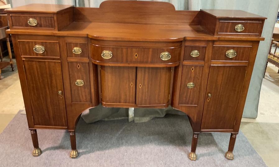 Exceptional English Bow Front Sodeboard: Centennial, banded hand dovetailed drawers, bottle drawers with inserts, inlaid key escutcheons, French polish, brass paw feet. 50.4 tall x 701 wide x 23 deep